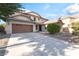 Lovely two-story home featuring an attached two-car garage and meticulous landscaping at 2608 Campobello Ave, North Las Vegas, NV 89081