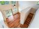 Open-concept living room with hardwood floors and staircase to upper level at 2608 Campobello Ave, North Las Vegas, NV 89081