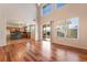 Spacious hardwood floor living room with a view of the kitchen and backyard at 2608 Campobello Ave, North Las Vegas, NV 89081