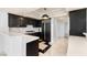 Modern kitchen showcasing dark cabinetry, stainless steel appliances, and quartz counters at 2777 Paradise Rd # 303, Las Vegas, NV 89109