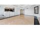 Wide angle view of living room shows wet bar, decorative mirror, and black accent flooring at 2777 Paradise Rd # 303, Las Vegas, NV 89109