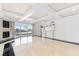 Living area with fireplace, wet bar, tile floors, and floor to ceiling windows with city views at 2777 Paradise Rd # 303, Las Vegas, NV 89109