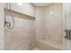 The shower is tiled and features a built-in bench, handheld showerhead and a recessed shelf at 2777 Paradise Rd # 303, Las Vegas, NV 89109