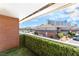 Unit balcony with manicured hedge overlooking complex parking and city views at 2866 Loveland Dr # 2018, Las Vegas, NV 89109