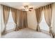 Cozy bedroom features soft carpet, neutral walls, ceiling fan, and windows with modern window coverings at 2866 Loveland Dr # 2018, Las Vegas, NV 89109