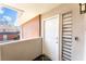 Condo entryway featuring a secure white door with a modern keypad and a view of the city skyline at 2866 Loveland Dr # 2018, Las Vegas, NV 89109