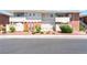 Inviting condo featuring a well-maintained exterior with red rock landscaping and quaint, fenced-in patio area at 2866 Loveland Dr # 2018, Las Vegas, NV 89109