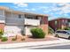 Charming condo building with a fenced patio, red rock landscaping and convenient parking at 2866 Loveland Dr # 2018, Las Vegas, NV 89109