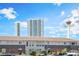 Inviting condo complex with lush landscaping and views of the city skyline at 2866 Loveland Dr # 2018, Las Vegas, NV 89109