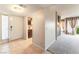 Inviting condo foyer with tile flooring, a view of the kitchen, and access to the carpeted living room at 2866 Loveland Dr # 2018, Las Vegas, NV 89109