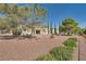 Landscaped backyard with trees and patio area, perfect for relaxation and outdoor enjoyment at 3104 Hayden Ct, Las Vegas, NV 89134