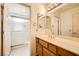 Bathroom featuring a single sink vanity, large mirror, and a walk-in shower for added convenience at 3104 Hayden Ct, Las Vegas, NV 89134