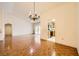 Open-concept dining and living area with a chandelier and view into the kitchen at 3104 Hayden Ct, Las Vegas, NV 89134