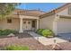 Welcoming front entrance adorned with decorative wreaths, flanked by green shrubs and walkway lighting at 3104 Hayden Ct, Las Vegas, NV 89134