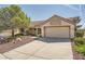 Inviting single-story house with a landscaped yard and attached two-car garage at 3104 Hayden Ct, Las Vegas, NV 89134