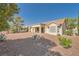 Single story home featuring a tile roof and desert landscaping with decorative rocks at 3104 Hayden Ct, Las Vegas, NV 89134