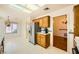 Bright kitchen with stainless steel refrigerator, breakfast nook, and wood cabinets, creating a functional space at 3104 Hayden Ct, Las Vegas, NV 89134