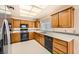 A well-lit kitchen with stainless steel appliances, light countertops, and traditional wood cabinetry at 3104 Hayden Ct, Las Vegas, NV 89134