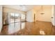 Spacious living room featuring a ceiling fan, chandelier and sliding glass doors to backyard at 3104 Hayden Ct, Las Vegas, NV 89134
