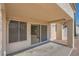 Covered patio area with sliding glass doors and neutral color stucco at 3104 Hayden Ct, Las Vegas, NV 89134