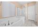 Bright bathroom featuring a soaking tub and separate glass-enclosed shower at 33 Via Di Mello, Henderson, NV 89011