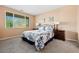 Comfortable bedroom with large window and neutral decor at 33 Via Di Mello, Henderson, NV 89011