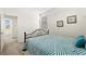 Comfortable bedroom featuring a cozy bed with striped comforter and ocean-themed wall decor at 33 Via Di Mello, Henderson, NV 89011
