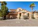 Two-story home featuring a two car garage, well-maintained landscaping and tile roof at 33 Via Di Mello, Henderson, NV 89011