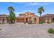 Inviting single-Gathering home with desert landscaping, a paver driveway, and a two-car garage at 33 Via Di Mello, Henderson, NV 89011