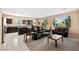 Open floor plan showcasing the black kitchen cabinets and spacious living area at 33 Via Di Mello, Henderson, NV 89011