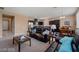 Open concept living area with dark wood cabinets, neutral colors, and lots of natural light at 33 Via Di Mello, Henderson, NV 89011