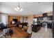 Bright open-concept living space with a dining area, kitchen, and comfortable seating at 33 Via Di Mello, Henderson, NV 89011