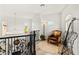 Bright loft area with decorative iron railing, chandelier, and unique decor at 366 Rancho La Costa St, Las Vegas, NV 89138