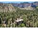 Majestic mountain home featuring lush trees and beautiful mountain views at 4162 Matterhorn Way, Las Vegas, NV 89124