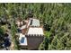 Unique home boasts a rooftop deck, turret and metal roof nestled among mature trees at 4162 Matterhorn Way, Las Vegas, NV 89124