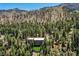 Back of home features large windows and balconies with scenic mountain views at 4162 Matterhorn Way, Las Vegas, NV 89124