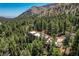 Stately home amongst many trees with rooftop deck with mountain view at 4162 Matterhorn Way, Las Vegas, NV 89124