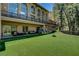 Large backyard with plush landscaping, seating area and amazing architecture at 4162 Matterhorn Way, Las Vegas, NV 89124
