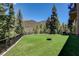Enjoy a large backyard with a fire pit and picturesque mountain views at 4162 Matterhorn Way, Las Vegas, NV 89124
