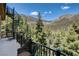 A spiral staircase and forest views highlight the charm of the balcony area at 4162 Matterhorn Way, Las Vegas, NV 89124