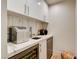 Stylish bar area with marble countertop, modern appliances, and elegant cabinetry at 4162 Matterhorn Way, Las Vegas, NV 89124