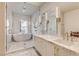 Modern bathroom with marble floors, double vanity, soaking tub, and glass shower at 4162 Matterhorn Way, Las Vegas, NV 89124