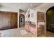 Charming bedroom showcasing a bunkbed with built-in playhouse, archway, and hardwood doors at 4162 Matterhorn Way, Las Vegas, NV 89124
