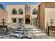 Stately home with grand entrance, stone detailing, and wrought iron railings at 4162 Matterhorn Way, Las Vegas, NV 89124