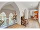 Hallway with arched windows, hardwood floors, and decorative lighting at 4162 Matterhorn Way, Las Vegas, NV 89124