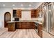 Kitchen with custom wood cabinets, granite countertops, and stainless steel appliances at 4162 Matterhorn Way, Las Vegas, NV 89124