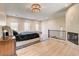 Spacious main bedroom with an ornate fireplace, wood floors, and large windows at 4162 Matterhorn Way, Las Vegas, NV 89124