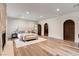 Expansive bedroom features wood floors, fireplace, and access to arched doorway at 4162 Matterhorn Way, Las Vegas, NV 89124