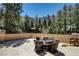 Outdoor patio with wicker seating offers a relaxing space surrounded by lush greenery at 4162 Matterhorn Way, Las Vegas, NV 89124