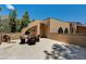 An elevated patio with outdoor seating shows mountain views and architectural details at 4162 Matterhorn Way, Las Vegas, NV 89124